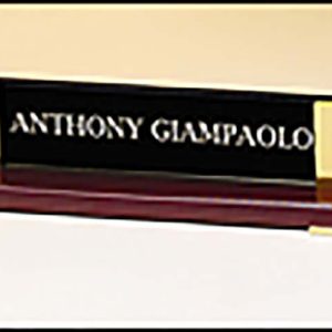 Rosewood piano-finished nameplate with gold metal accents