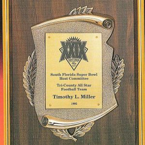 Oak wood finish plaque with gold scroll casting and frame