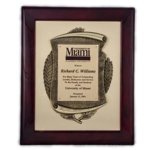 14'' x 17'' rosewood piano-finished frame with gold scroll casting on gold metal background