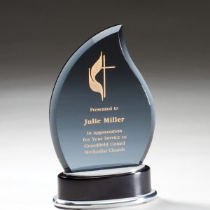 Smoked glass flame mounted on black base with brushed aluminum accents