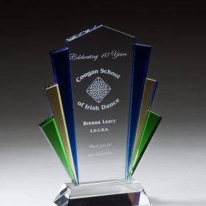 Glass award with blue, green, and gold sides