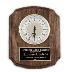 10.5'' x 13'' walnut wall clock with ivory dial and three-hand movement